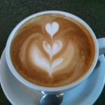 coffee cup white heart in brown foam pattern