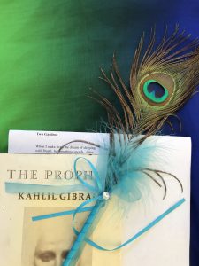 Peacock Feather, The Prophet by Kahlil Gibran, two lines of poem Two Gardens tucked in book
