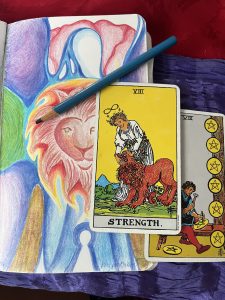 Color penciel drawing of an angel with keyhole at bottom of skirt and a lion's face over her heart, a blue color pencil diagonally above woman holding head of lion and apprentice working on disks both Rider Waite Smith images for Strength and 8 Pentacles
